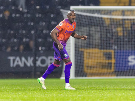 Action photo of Omar Beckles in orange away kit