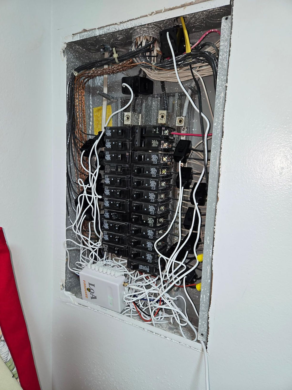 Close-up view of a Fireguard fire prevention control panel inside a New York home