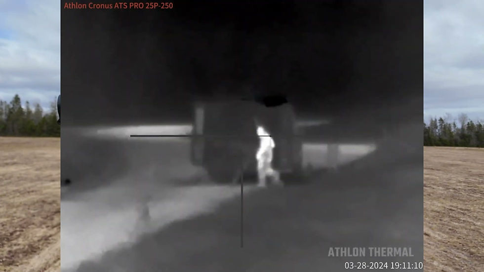 Thermal optic view at 100 m with the heated plate glowing on the left and a person glowing on the right