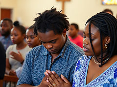prayer services with at an african american church with husband wife children praying.jpg