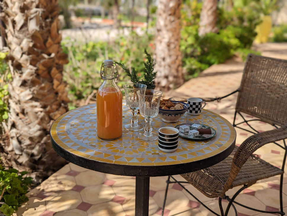 Terrace table with coffe and orange juice