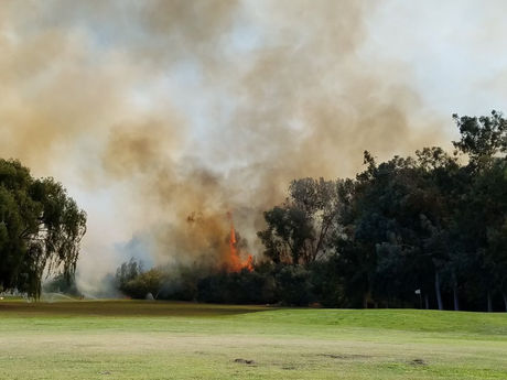 River Bottom Fire Encroaches On Jack Tone Golf Course and Custom Homes