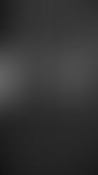 old phones on a black wall