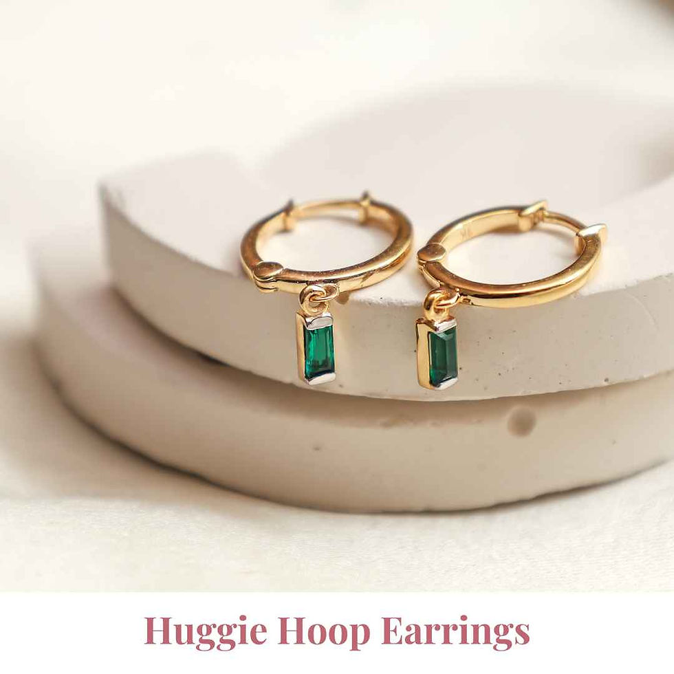 Gold huggie hoop earrings with a sleek, compact design, perfect for a subtle, everyday look