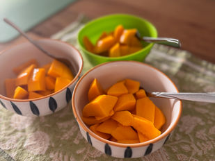 Three bowls of freshly chopped alphonso mango.