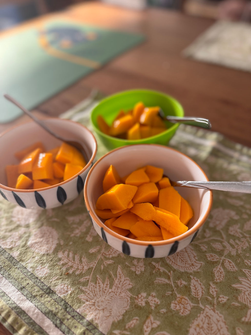 Three bowls of freshly chopped alphonso mango.