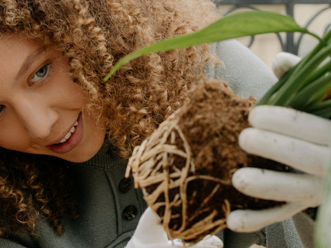 a woman holding roots