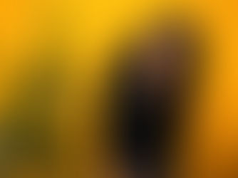 a woman with indoor plants and bright yellow background