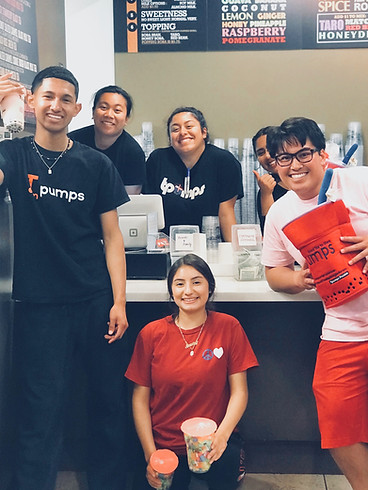 Group of Tpumps workers smiling near order area at Tpumps store in Burlingame