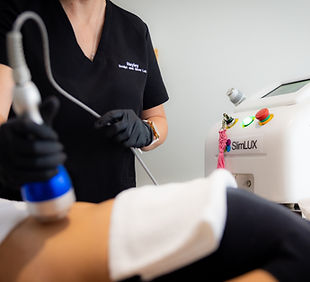 fat cavitation body sculpting treatment being performed on a clients abdomen to reduce stubborn fat and contour the body.