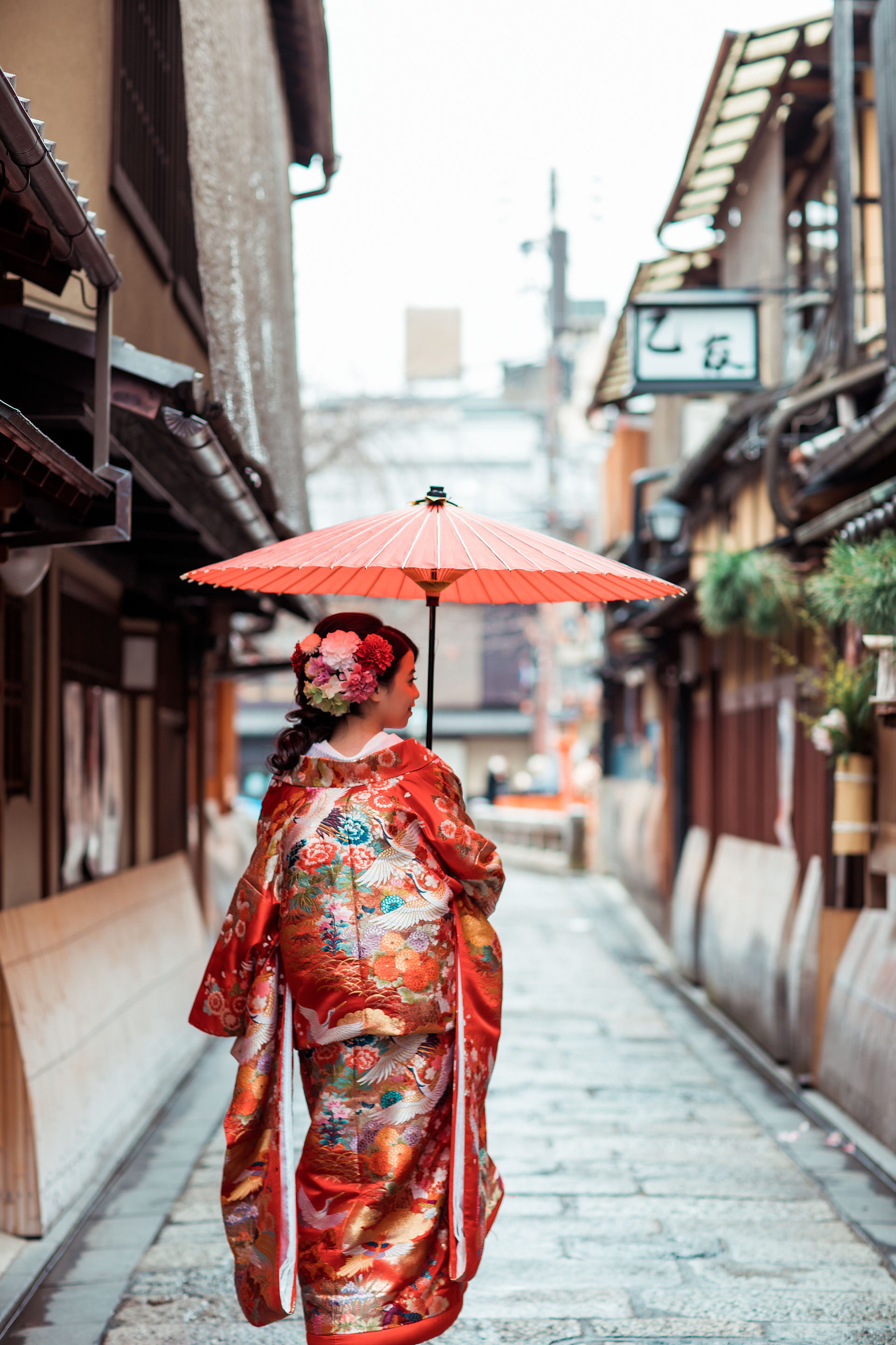 Bride in formal kimono walking through a traditional Kyoto street