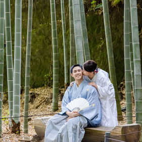 Japanese wedding couple seated together in a peaceful Kamakura bamboo grove
