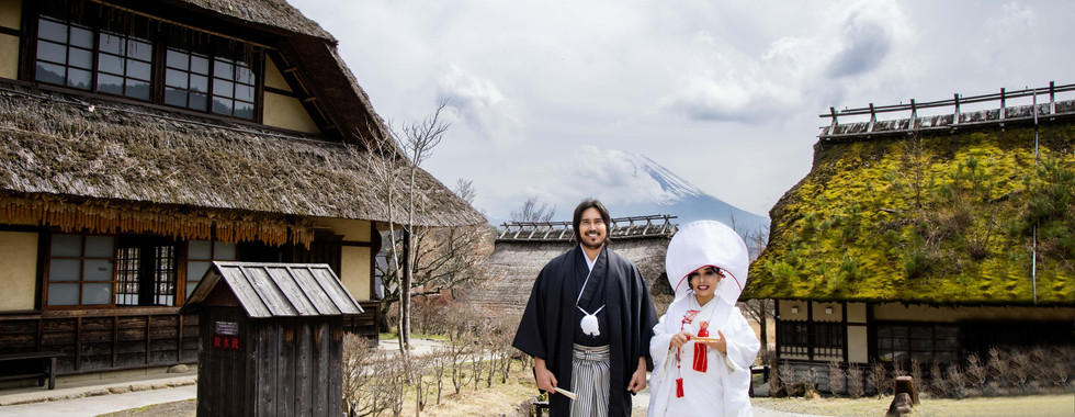 traditional shrine wedding portrait in historic village scenery
