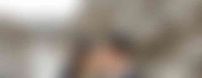 close up winter wedding portrait with snowy mountain scenery