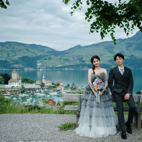 switzerland prewedding couple overlooking alpine village view