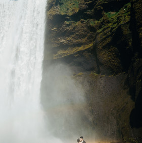iceland prewedding couple waterfall rainbow dramatic