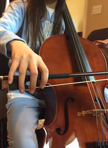 A Child Musician Playing Their Instrument