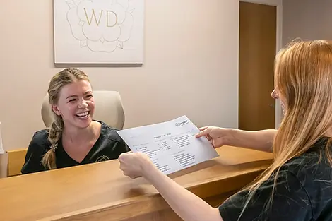 White Dental team member discussing Denplan membership options with a patient.