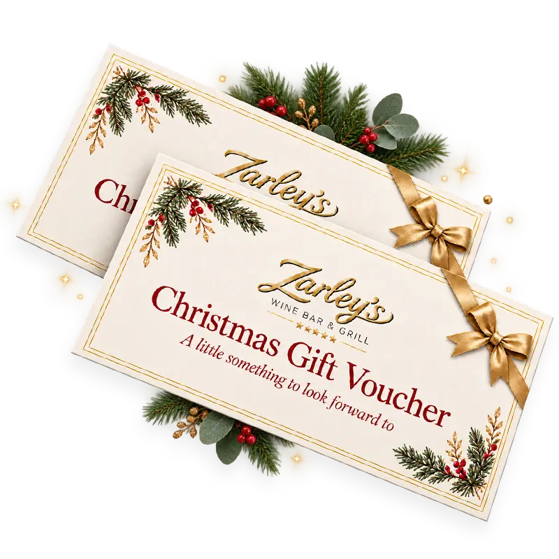 Two Zarley’s Christmas gift vouchers with gold bows beside festive greenery and gold sparkles.