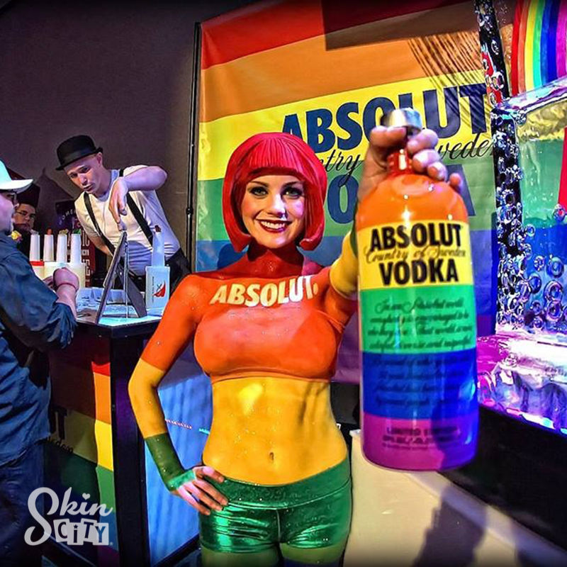 A Skin City body painted model poses at an event