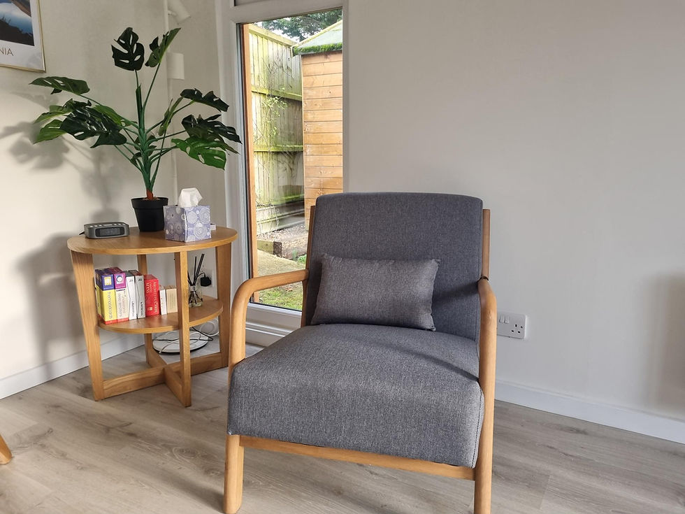 Close-up view of a calm therapy room with soft lighting and comfortable seating