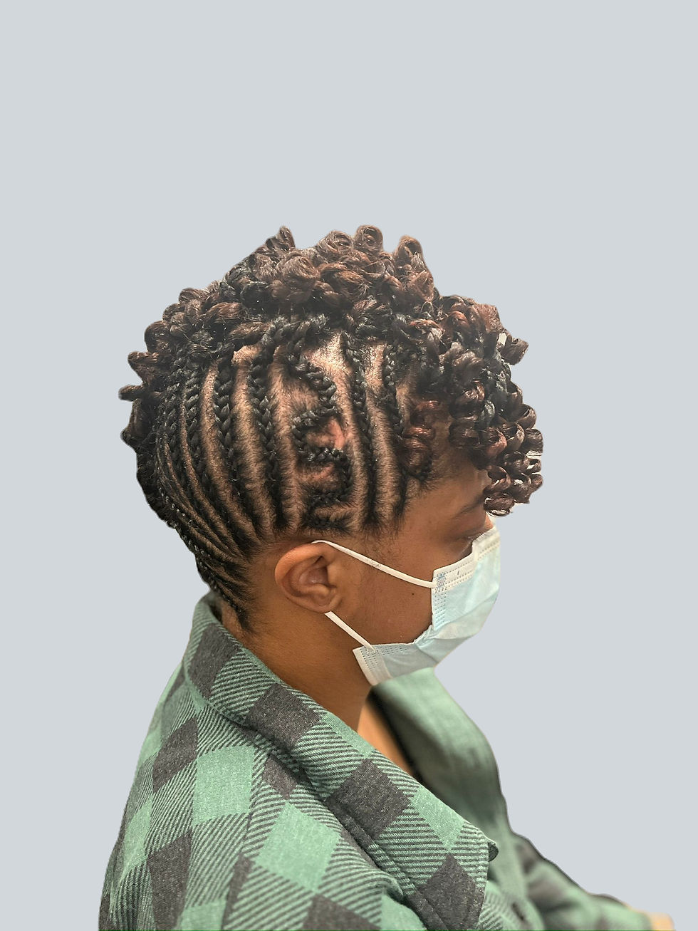 Fun updo style cornrows, two strand twist and a rod set to camouflage heat damage