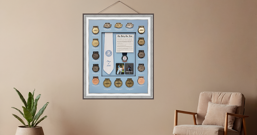 Custom shadow box framing display featuring sports medals, memorabilia, photographs, and keepsakes professionally framed in Roswell GA