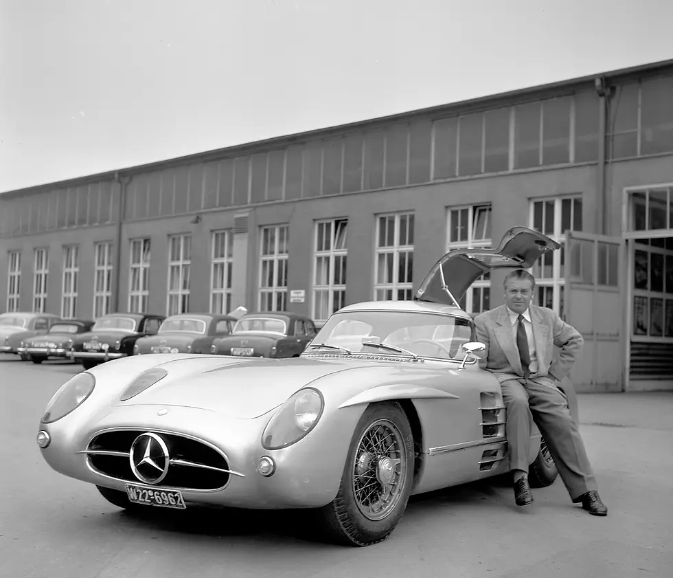 Historic photograph of the legendary Mercedes-Benz 300 SLR Uhlenhaut Coupé with engineer Rudolf Uhlenhaut, one of the most valuable and influential automobiles in automotive history.