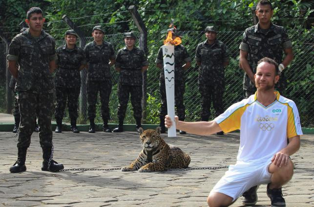 Athlete posing with Juma the jaguar