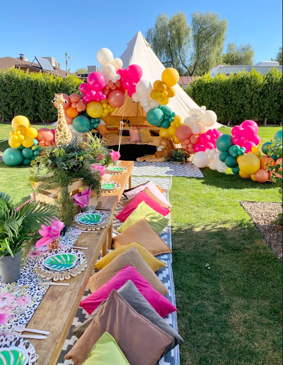 Colorful custom balloon garland with bell tent picnic party by AZ Sleepy Teepee in Scottsdale Arizona