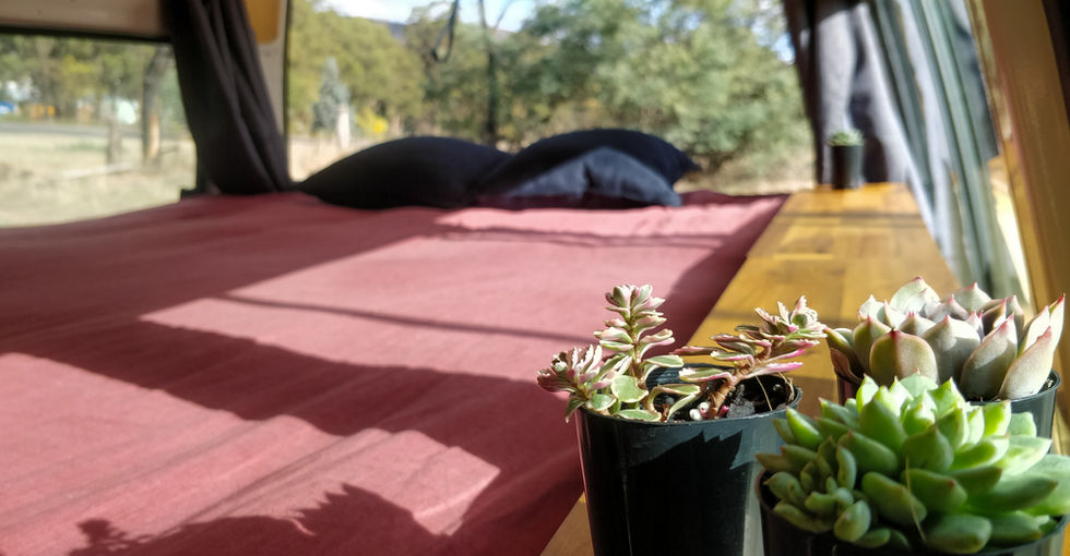 Campervan rental double bed with sheets in Tasmania