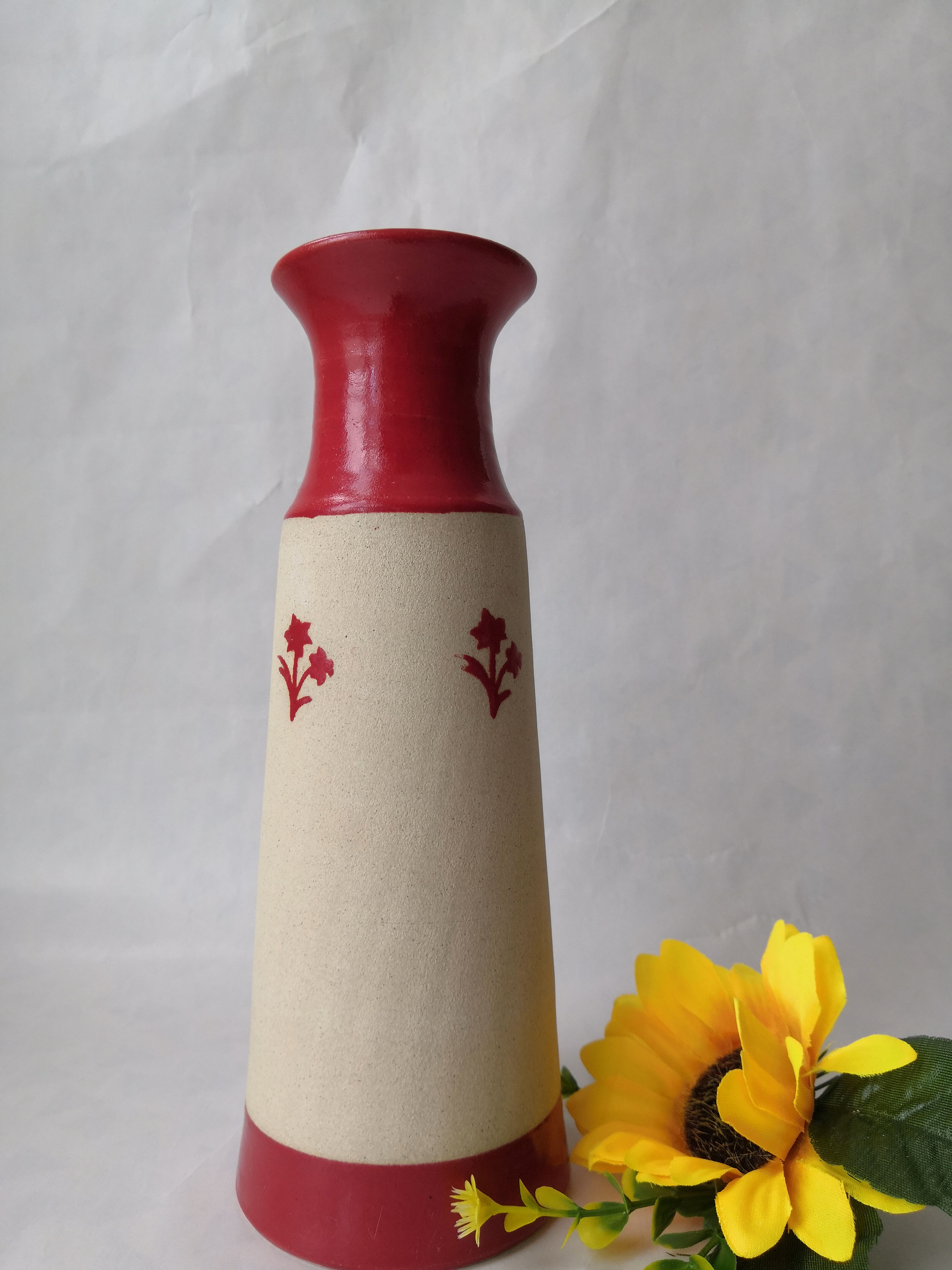 Ceramic wheelthrown vase/bottle with red flowers