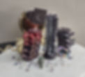 Nocturnal Designs pillar candles in the shape of spines in black and red beeswax