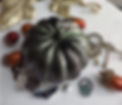 Our spider pumpkin beeswax candle in spooky green and black.