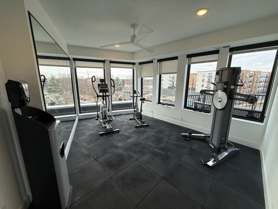 Fitness center at In the City Apartments