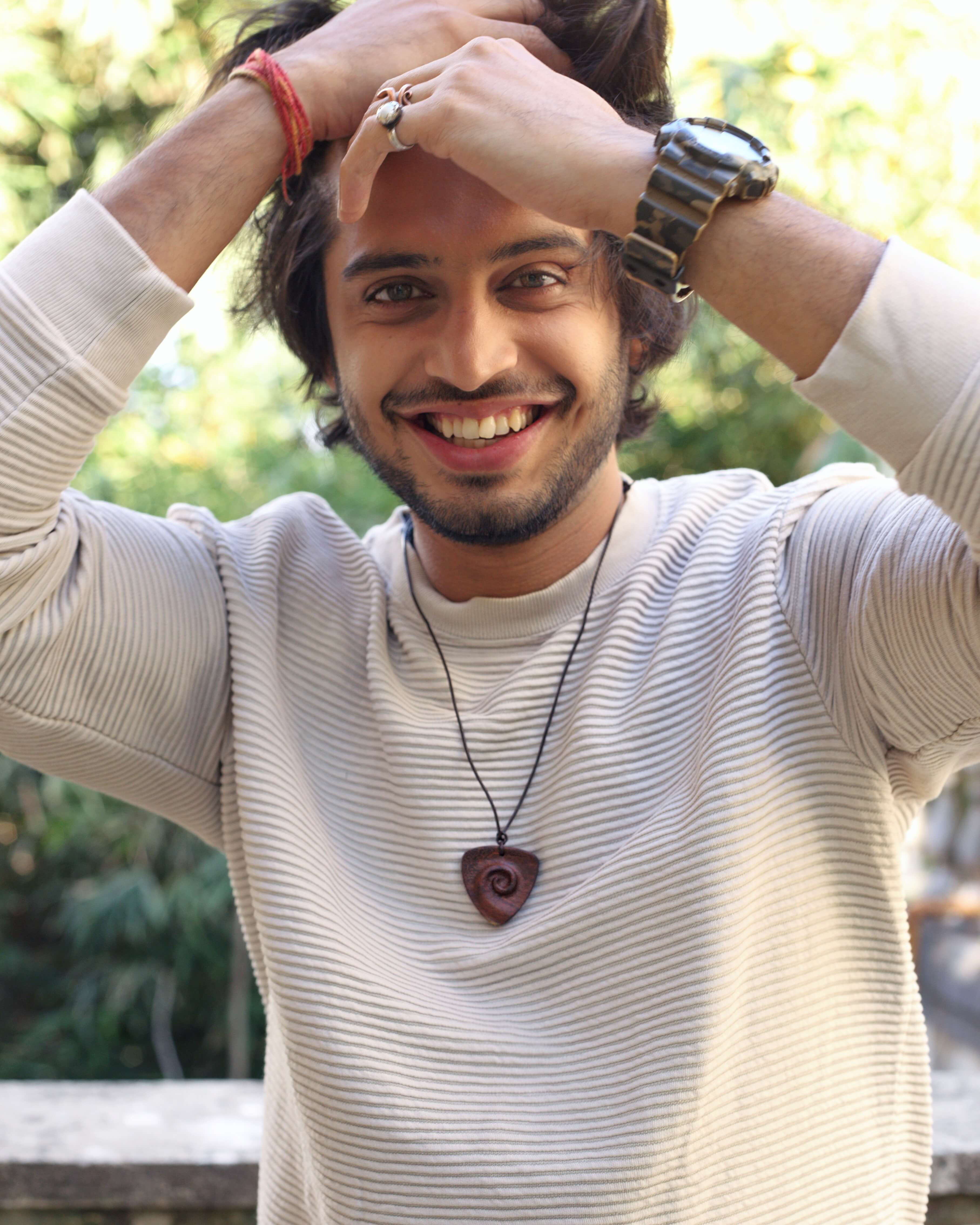Spiral hand-carved teak wood pendant