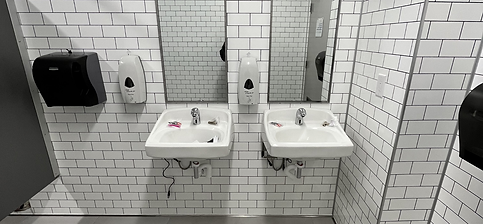 A set of commercial bathroom sinks remodeled by GC Home Remodeling
