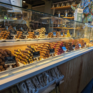 rows of cannolis in a market
