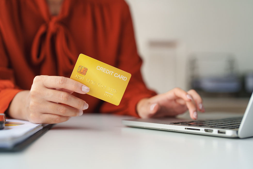 Lady making an online purchase with her credit card.