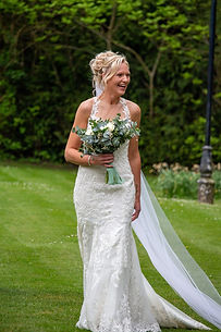 Bride carrying wedding bouquet