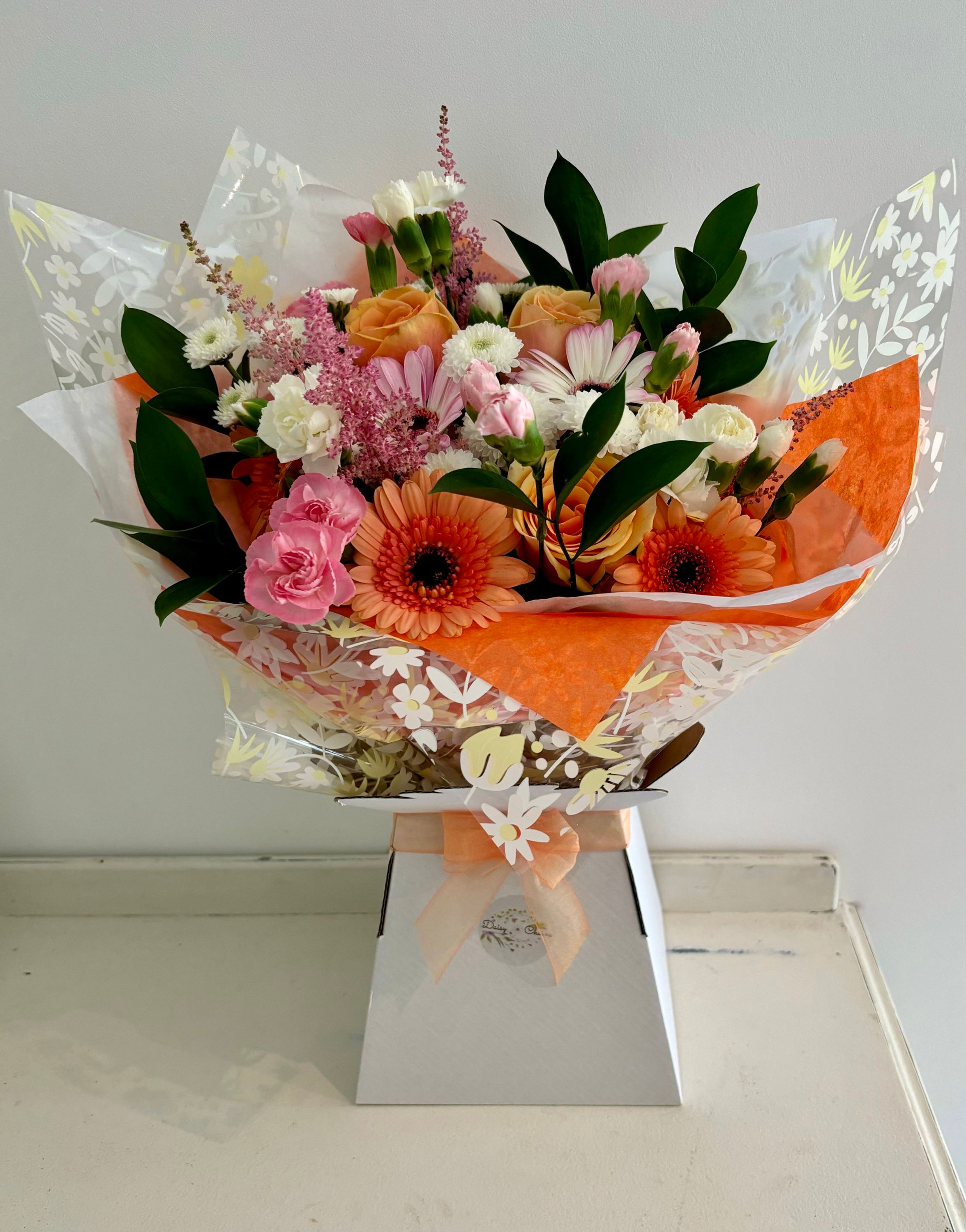 Pink and orange handtied bouquet