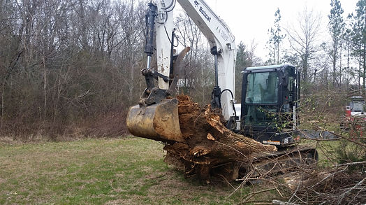 Hamby Land Management dgging out a stump with a Bobcat E85 Excavator!