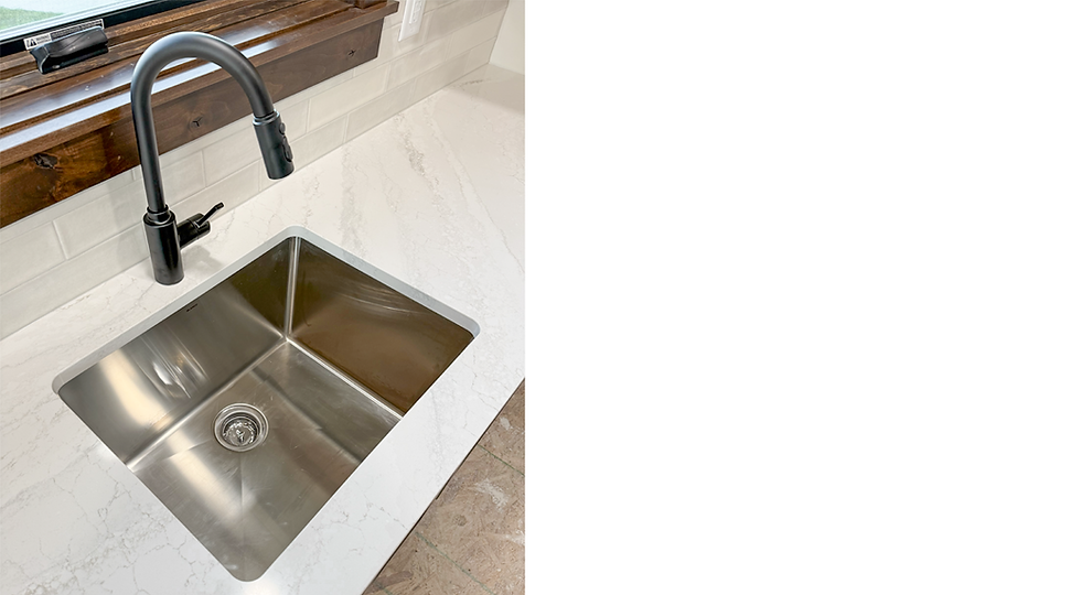 Blanco Quatrus stainless steel laundry sink and Modern Genta put down sprayer faucet.