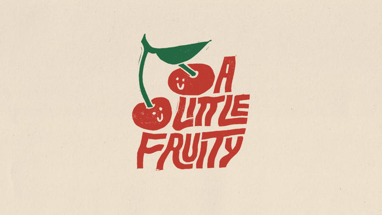 Lino-cut lettering that reads 'A little fruity' with an illustration of a pair of cherries. 