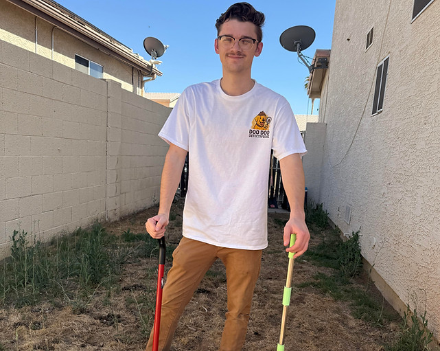 Blake Price, owner of Doo Doo Detectives AZ, standing in uniform with cleanup tools