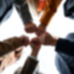 from the low to up angle show group of 5 official people standing all-around and joining