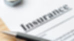 Close-up of a pen on an insurance document, representing digital policy management with Wizergos low-code platform.