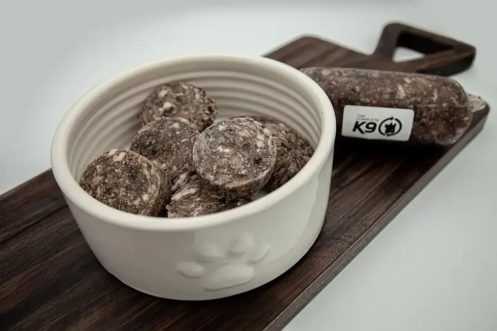 photo of a bowl of Four Roots Green Beef Tripe product with a chub beside it.