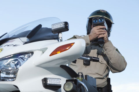 Laser diffuser sensors mounted discreetly on the front grille of a vehicle