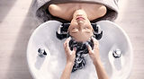 Client enjoying a relaxing authentic Japanese head spa at EQ 